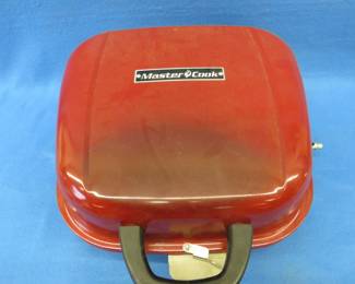 Lot 302. Portable Master Cook propane grill.&nbsp; Uses 1-pound bottles.