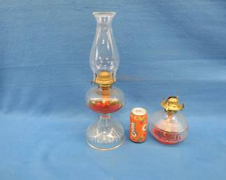 Lot 308. Two kerosene lamp bases and one chimney
