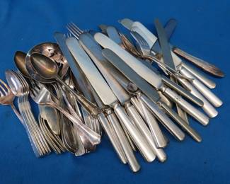 Lot 312. Seven pounds of old flatware