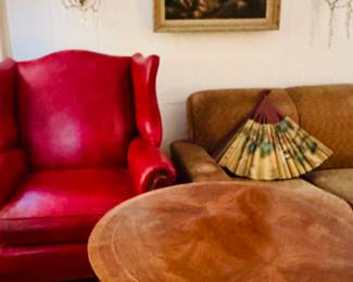 Red leather chair (2 of2 ). Pie top table. A pair of crystal scones. Beautiful fan and original oil on canvas
