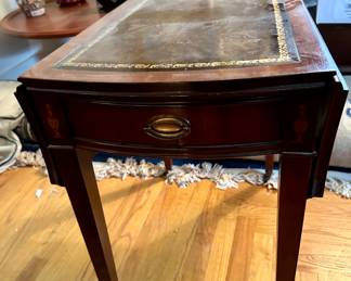 Leather top table with Chinese porcelain in the background.