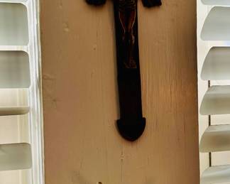 Carved wooden cross with cherub