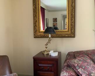 Wooden file cabinet, gold framed mirror