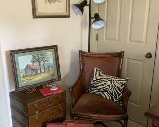 Local art, luggage stacked side table, leather briefcase 