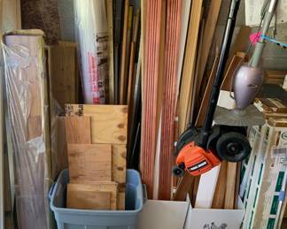Loads of wooden trim, foam sub flooring, packages of flooring, lawn and household tools.