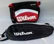Two Wilson Sports Equipment Bags: One Black Tennis Bag And One Black And Red Messenger Bag
