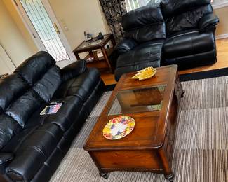 Black leather reclining couch and love seat