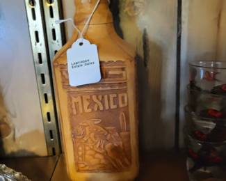 Hand tooled leather wrapped bottle