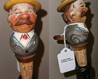 Hand carved in Italy this articulated wine stopper was made by the company ANRI in the 1940s. ANRI was founded in 1912 by Josef Anton Riffeser and named using the first two letters of his middle and last name, respectively. This company made beautifully detailed wood carved bottle stoppers until the mid 1960's. This piece features a well dressed gentleman sporting an impressive mustache and donning a hat that pops up to reveal a hidden face.
