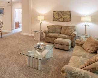 Florida Keys Coral Coffee table, side tables, dining table. Palm Tree Motif Sofa, loveseat, ottoman and lamps and Florida  and travel themed decor and art.