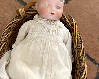Scary broken porcelain antique doll with antique dress.  Eyes and pieces included.