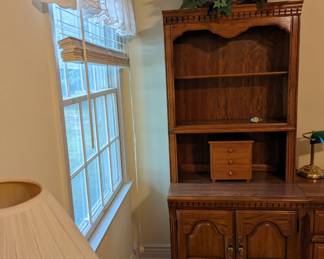 Shelf with storage and separate storage unit along side it.