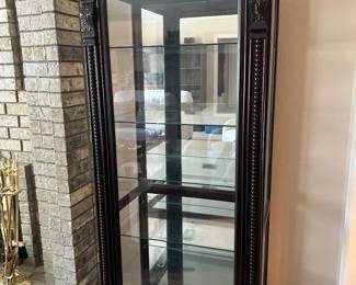 Curio cabinet with 6 glass shelves. Open with a sliding glass door