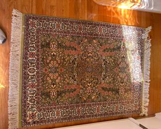 exceptional high count wool rug with many color tones, primary color is green