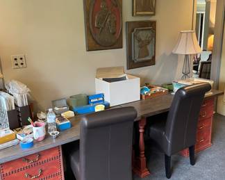 Two wooden desks with attached drawers