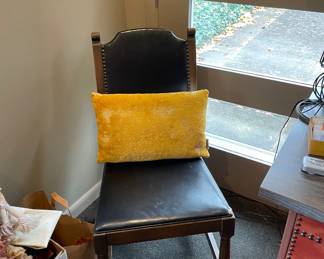 Leather and wooden chair with studs