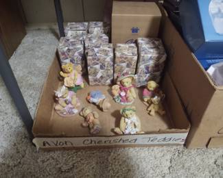 Avon cherished teddies. A box full...