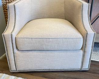 Neutral Gabby Home Swivel Chair With Nail Head Trim. Measures 32” W x 32” D. Photo 1 of 2.