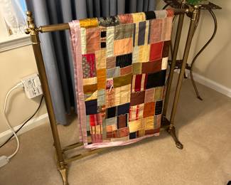 Silk quilt on a brass quilt rack