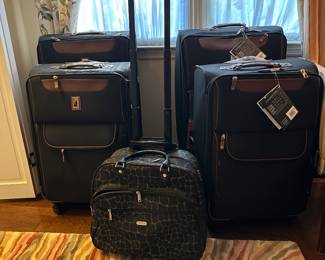 Luggage - new with tags quad rollers