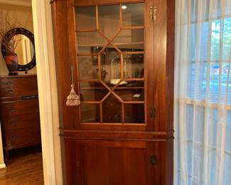 Pair of cherry chippendale style corner display cabinets
