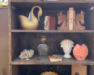 pottery, rock collection, old books, planters, vintage decor, bookends, brass, collectibles