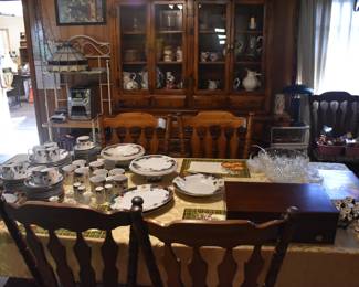 The dining table, six chairs, and the china cabinet/hutch are sold, but the dishes and punch bowl are still available