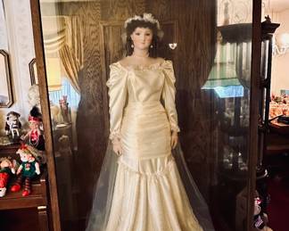 Amazing 4-1/2’ tall handmade porcelain doll with custom cabinet
Please make an offer!