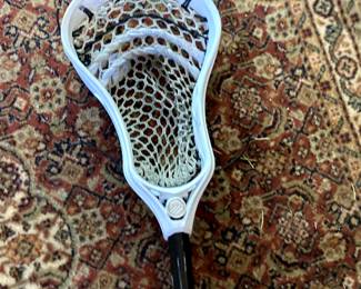 lax stick, dpole, and beautiful Belguim wool rug; heritage rug