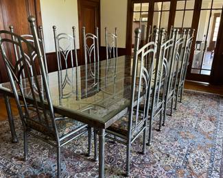 Stainless steel dining room table & 10 chairs. Created by the same company that manufactured the RTA bus shelters along Euclid Avenue. $16,000