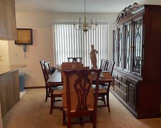 The dining room seats 8 to 12/14 people.  Two leaves are available with the purchase, eight chairs, and a china cabinet.
