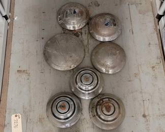 #7276 • (4) V8 Hubcaps & (4) Shield Emblem Bubcaps
