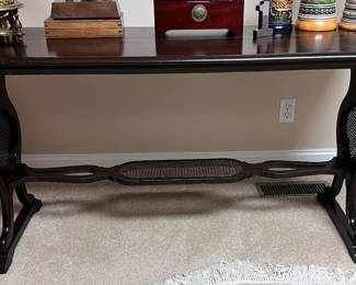 Mahogany table with rattan accents