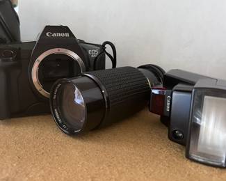 Canon EOS with telephoto lens and flash