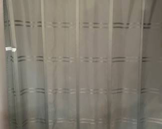 One of two shower curtains in master bathroom