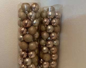 Two large containers of Christmas ornaments