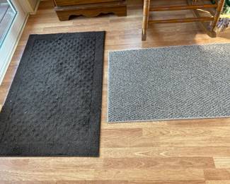 Two rugs on back porch