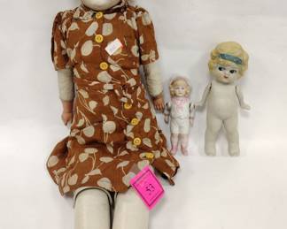 ANTIQUE DOLLS: ONE 19" LEATHER BODY, PORCELAIN HEAD. TWO BISQUE CARNIVAL DOLLS