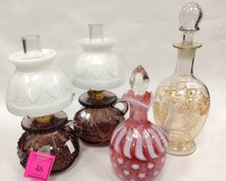 GLASS: PAIR OF SMALL BLOWN AMETHYST LAMPS, ENAMELED BLOWN GLASS DECANTER AND CRANBERRY GLASS CRUET. Cruet stopper has rought edges. Decanter stopper has chips on the tip