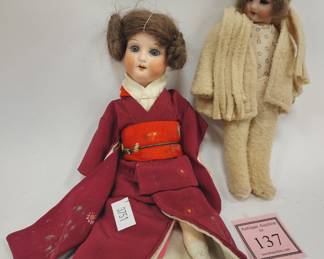 TWO VINTAGE SMALL DOLLS, BOTH COMPOSITION BODY WITH PORCELAIN HEADS AND SLEEPY EYES. TALLEST IS 8". BOTH LEGS CRACKED ON LARGER DOLL