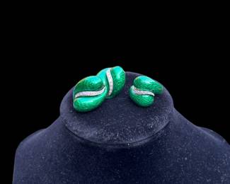 18k yellow gold ring and matching earrings.  The tops have a hard fired green enamel coating.  The ring has 12 single cut diamonds set in a white gold strip down its center.  Each earring has a matching white gold strip with nine diamonds in each.  They are a mix of single and round brilliant cuts.  Diamonds are eye clean and near colorless.  The total diamond weight is approximately 1 carat.  The earrings have omega backs.  The replacement written appraisal by Korona Jewelry is $4400  