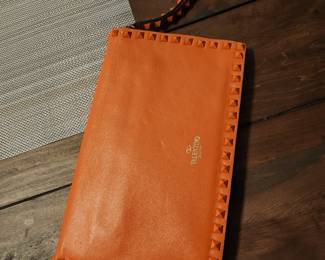 Valentino orange rockstud clutch