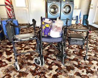 2 walkers with seats, and a wheelchair