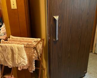 Lots of doilies and upright freezer
