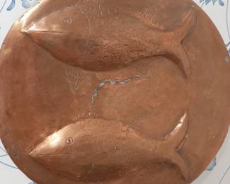 Several large copper dishes