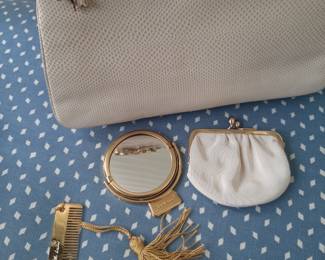 Vintage Judith Leiber purse with strap.  This beautiful purse is in lizard skin.  A remarkable addition to anyone collection!