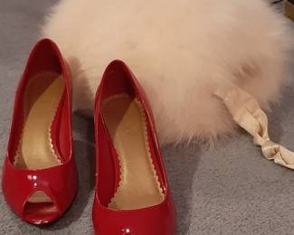 Silk Lined Fur Muff. Paired with these red pumps, you'll be the Belle of the Winter Ball.