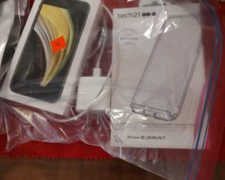 Older iPhone with charger and case