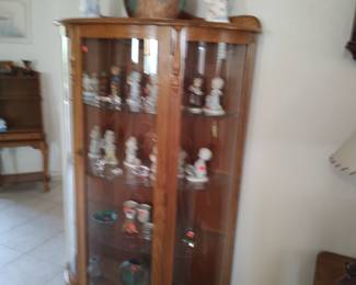 Beautiful vintage oak curio cabinet with curved glass front