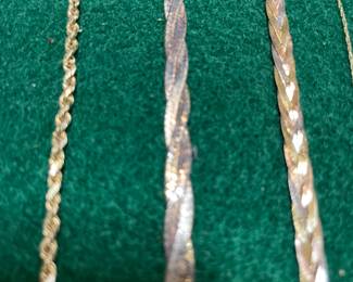 14k yellow gold rope, serpentine and woven chains of yellow, white and rose gold. 